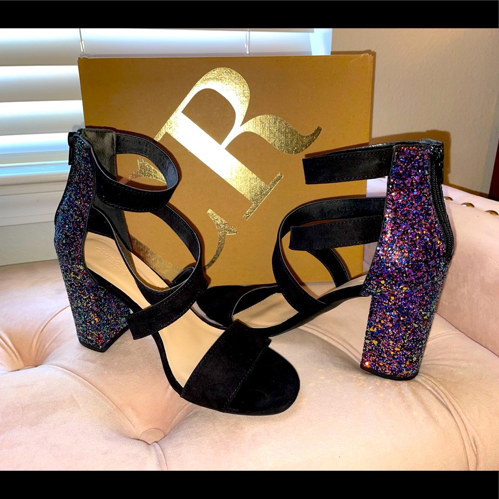 Charlotte Russe size 8 black heels that have a multi colored glitter heel.